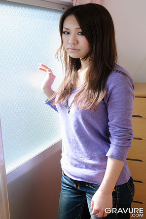 Teen Hiroko strips on bed and bares small tits and nice ass