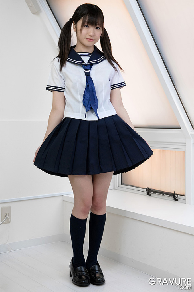 Shizuku wearing kogal uniform pulling at dark blue skirt pigtails falling on shoulders