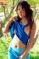 Tle aree wearing blue top and shorts pulling top over breasts showing panties