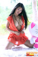 Patty oraphan kneeling unbuttoning dress revealing breasts long hair