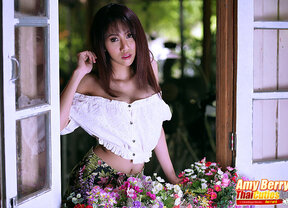 Amy Berry strips off the shoulder top and bares her nice tits