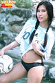 Wearing argentina shirt in panties hair in pigtails holding football
